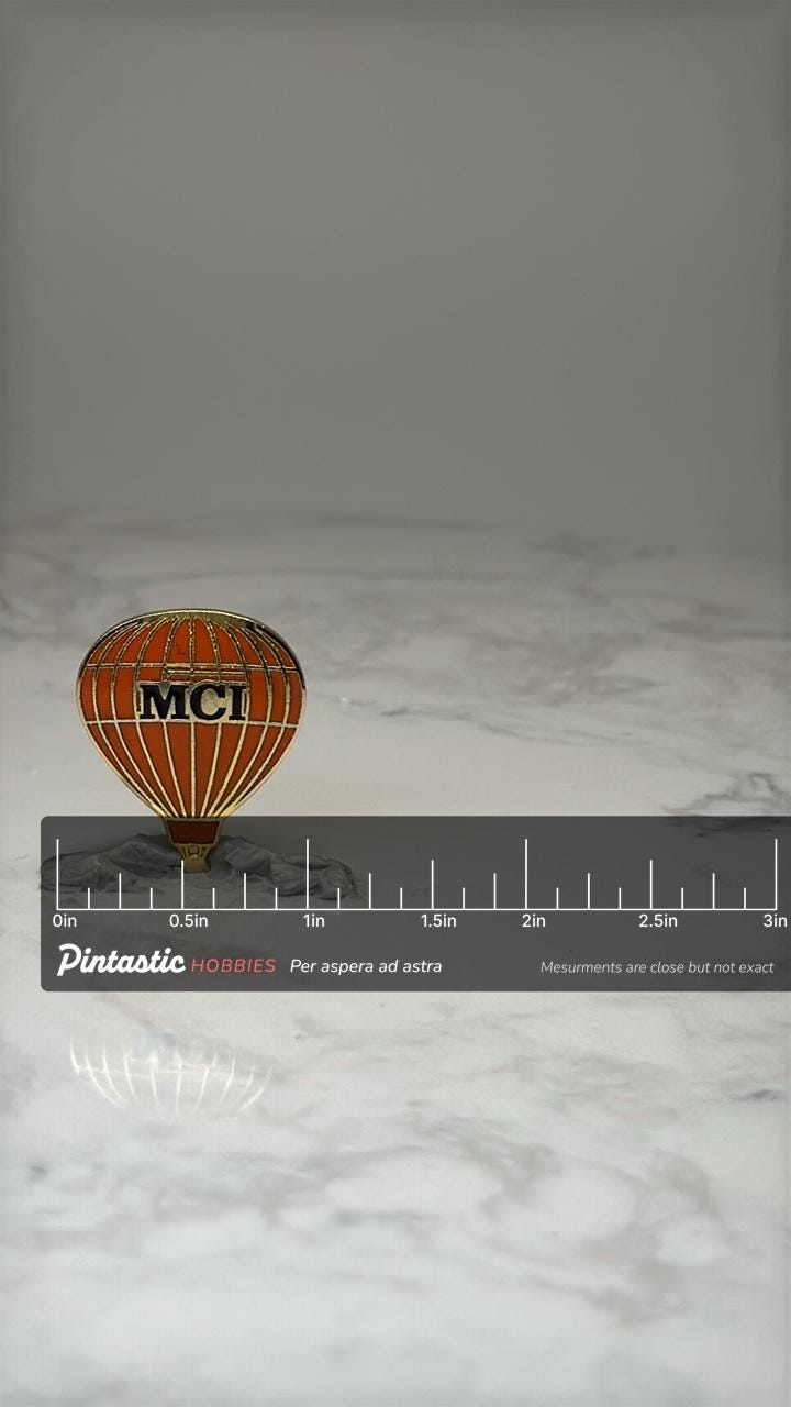 Vintage MCI Hot Air Balloon Enamel Lapel Pin Telecommunications with ruler overlay for size reference