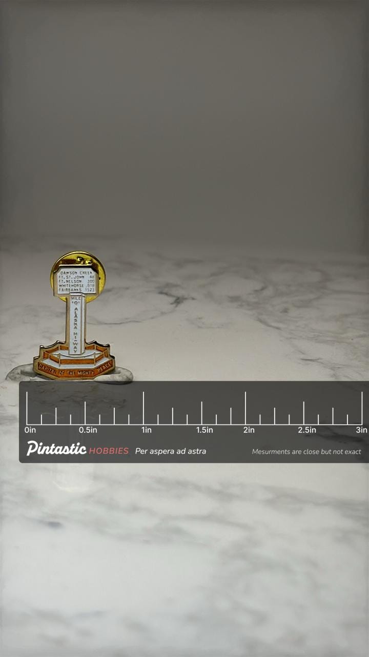 Vintage Mile 0 Alaska Highway Capital of the Mighty Peace Enamel Lapel Pin with ruler overlay for size reference