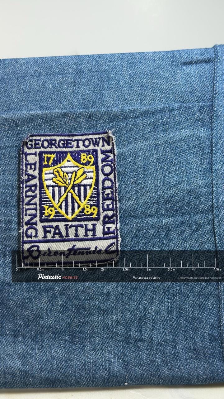 Georgetown Learning Faith Patch: Blue Gold Crest - College Accessory with ruler overlay for size reference