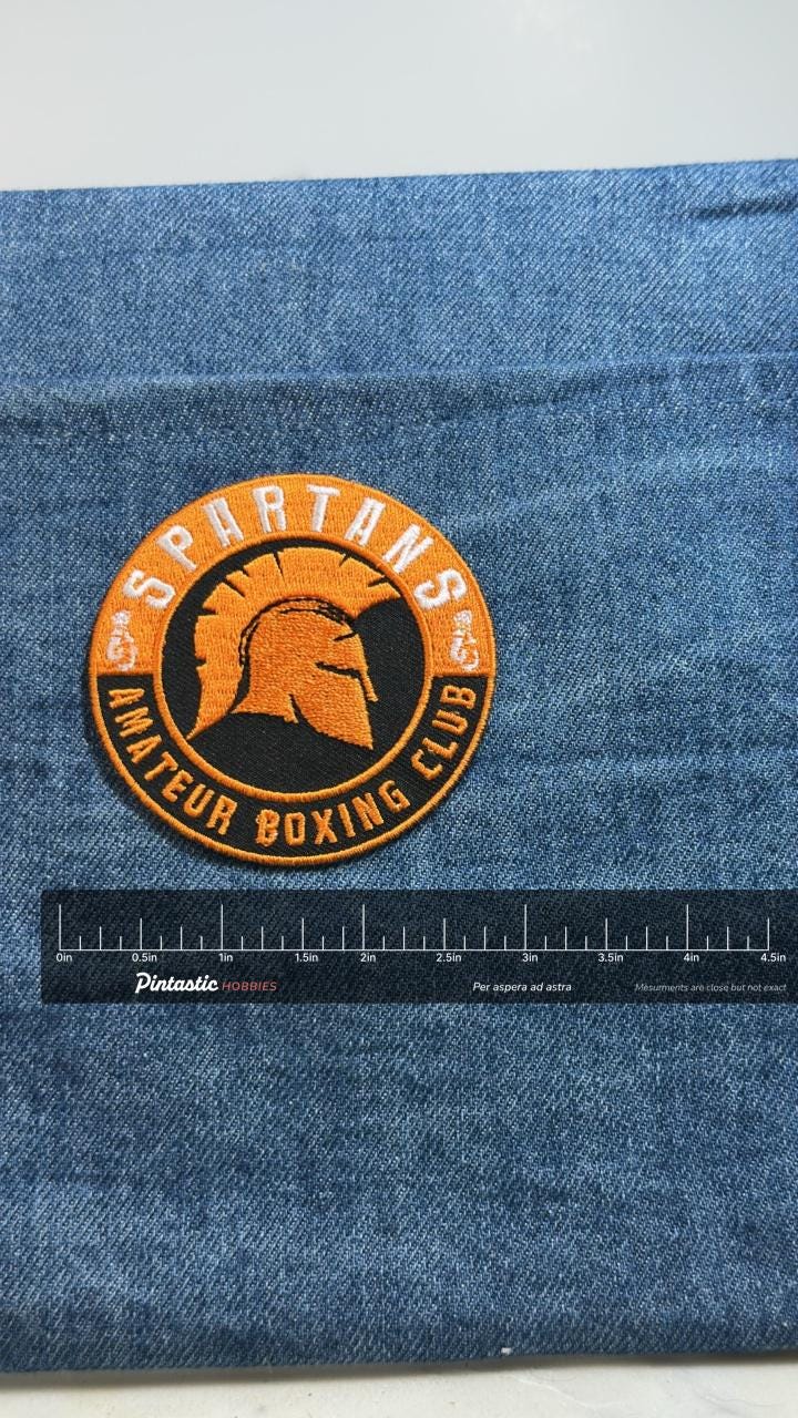 Spartans Amateur Boxing Club Patch: Orange Black - Sports Accessory with ruler overlay for size reference