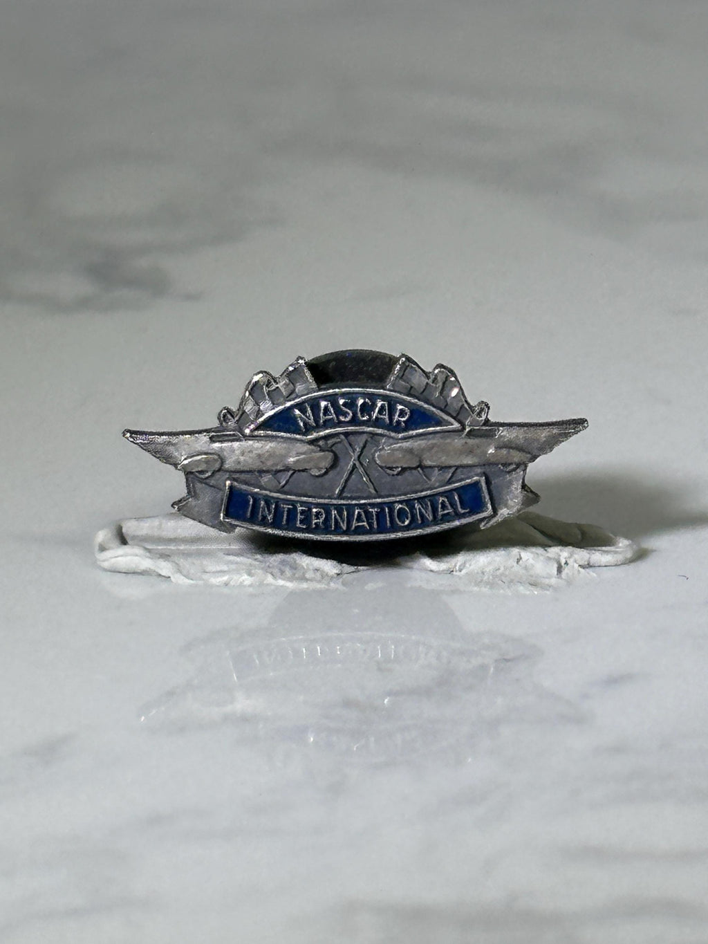 Nascar international pin: silver & blue enamel - vintage racing accessory