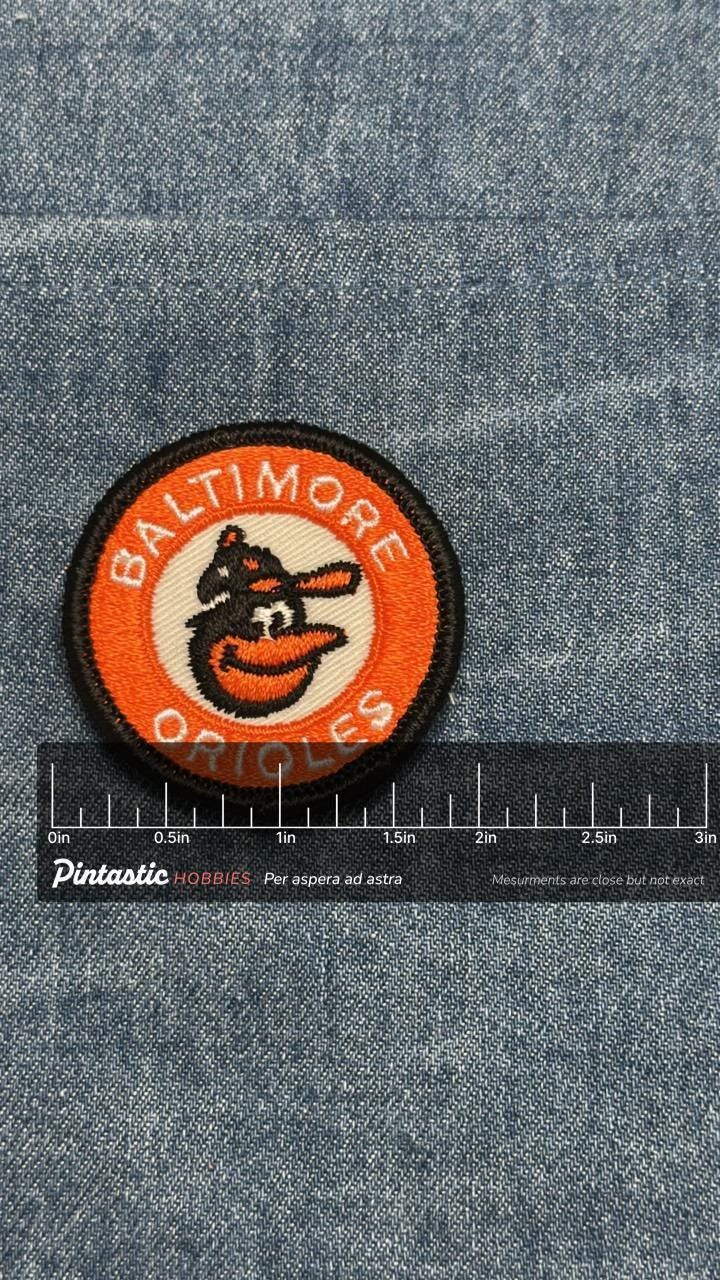 Baltimore orioles sew on patch: classic orange embroidered - retro sports accessory with ruler overlay for size reference