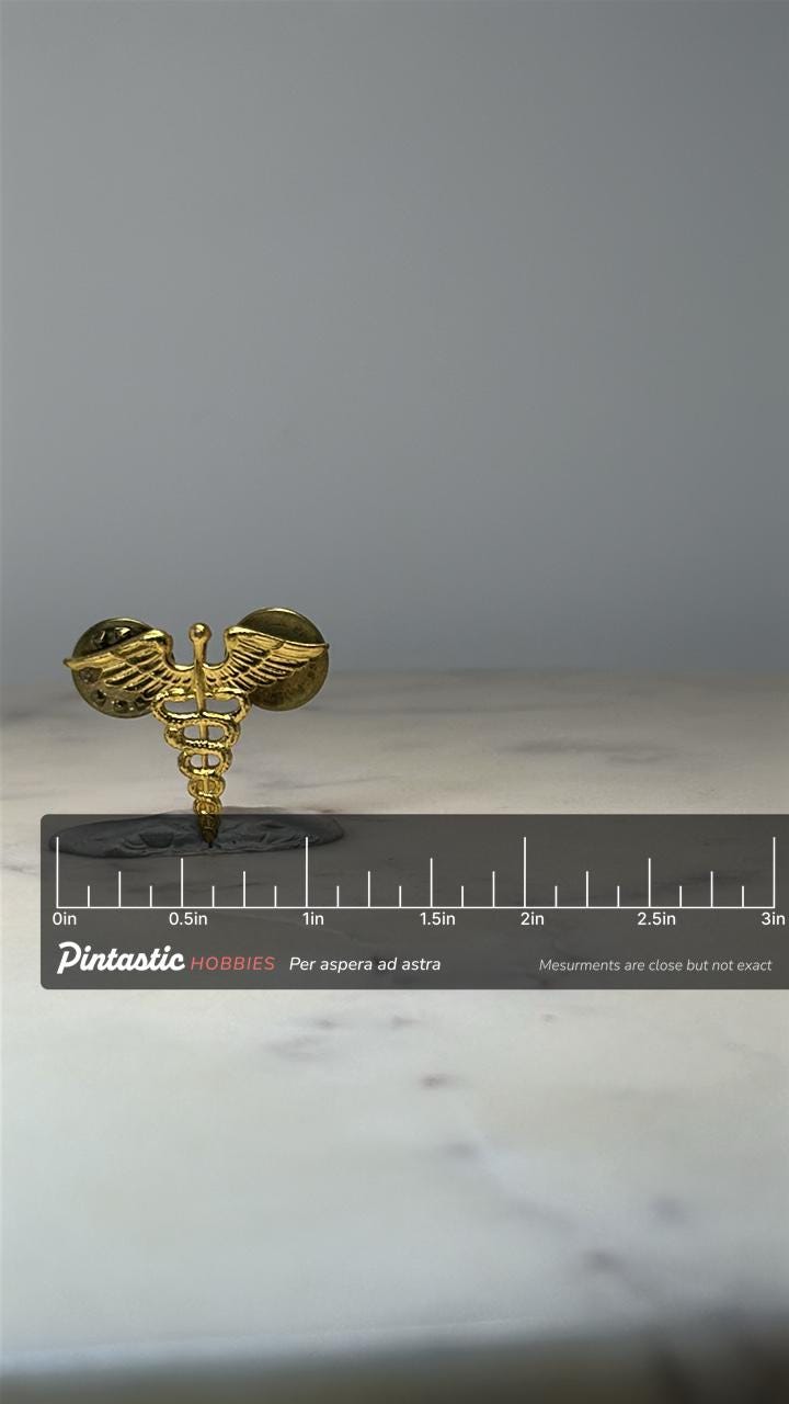 Medical Caduceus Lapel Pin: Gold Tone - Healthcare Symbol Accessory with ruler overlay for size reference