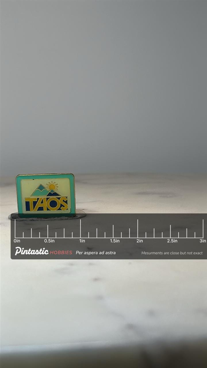 TAOS New Mexico Lapel Pin: Enamel Scenic Design - Souvenir Accessory with ruler overlay for size reference