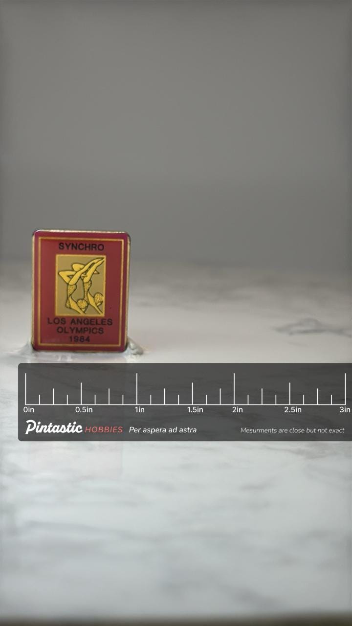 1984 Los Angeles Olympics Synchro Pin: Red Enamel - Summer Games with ruler overlay for size reference