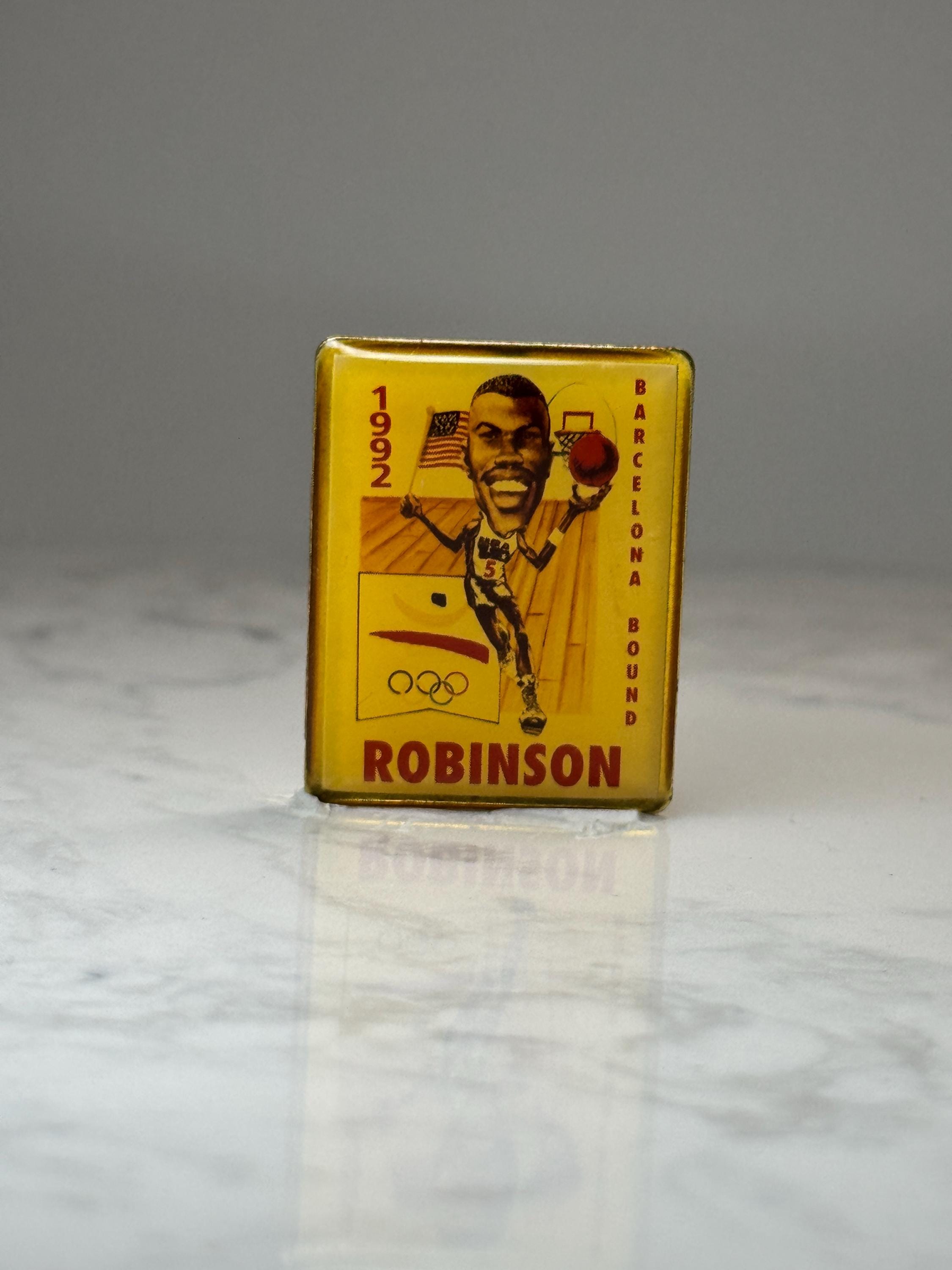 1992 Barcelona Robinson Basketball Pin: Gold Tone - Olympic Era Accessory