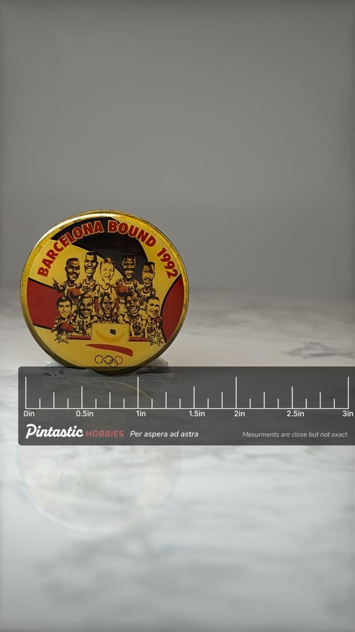 Barcelona Bound 1992 Olympic Basketball Pin: Gold Tone - USA Team with ruler overlay for size reference
