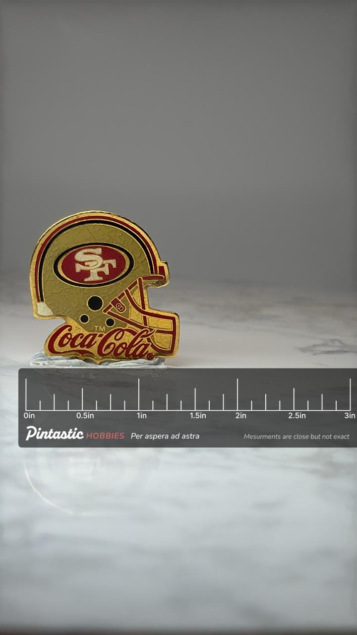 San Francisco 49ers Helmet Pin: Gold Enamel - NFL Coca Cola with ruler overlay for size reference