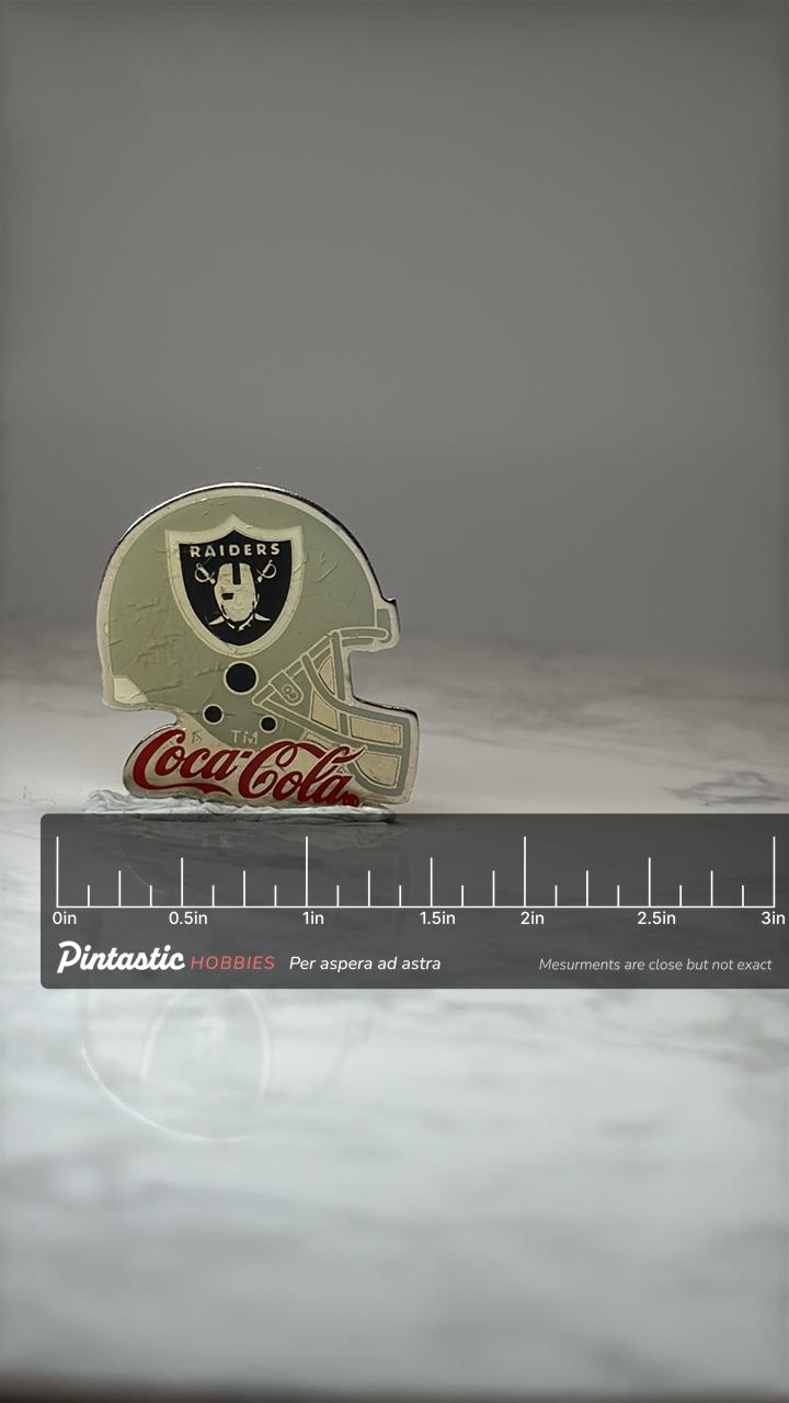 Raiders Helmet Coca Cola Pin: Silver Tone Enamel - NFL Promo Accessory with ruler overlay for size reference