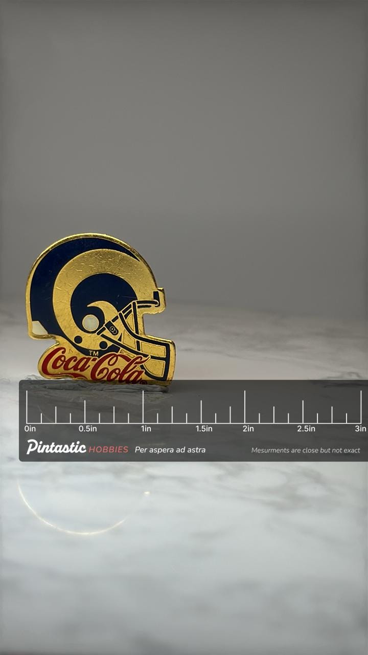 LA Rams Coca Cola Helmet Pin: Gold Tone Enamel - NFL Promo Accessory with ruler overlay for size reference