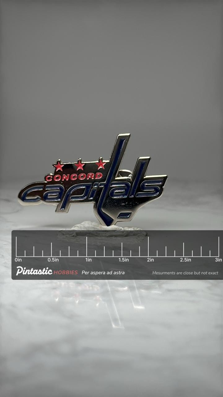 Concord Capitals Hockey Enamel Pin Vintage Sports Team Lapel Pin Blue Red Logo Pin with ruler overlay for size reference