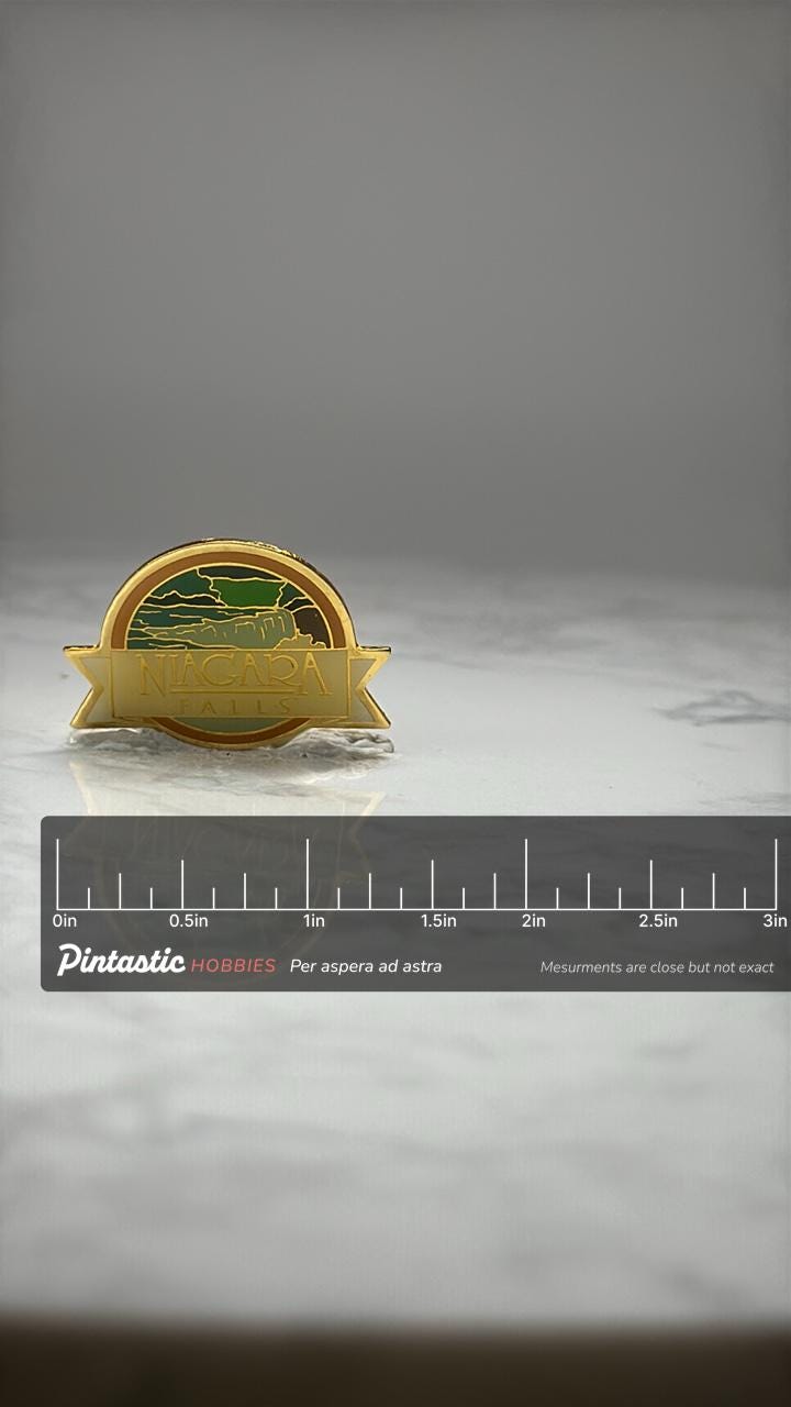 Niagara Falls Souvenir Pin: Gold Tone Enamel - Travel Landmark Accessory with ruler overlay for size reference