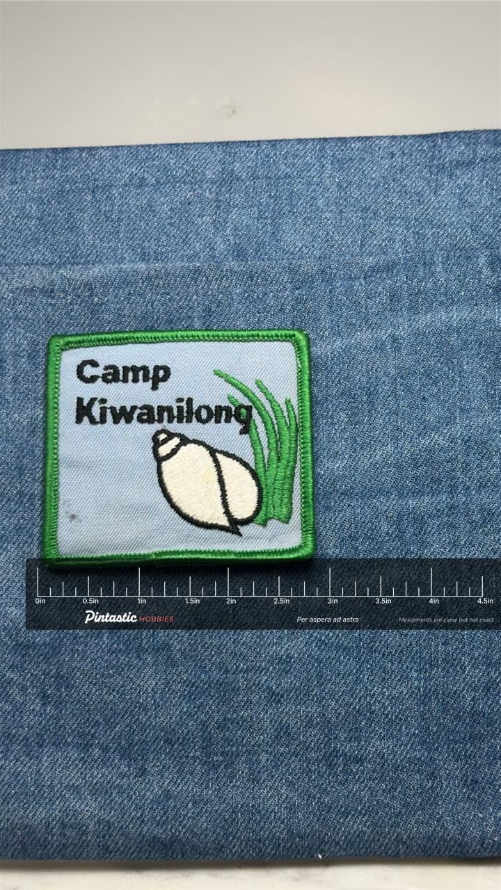 Camp Kiwanilong Patch: Green Border - Camp Souvenir Accessory with ruler overlay for size reference