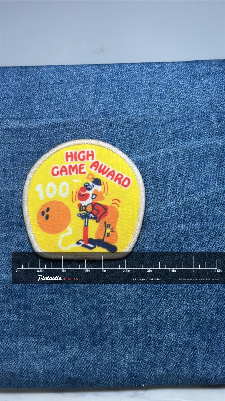High Game Award 100 Patch: Yellow Bowling - Sports Accessory with ruler overlay for size reference