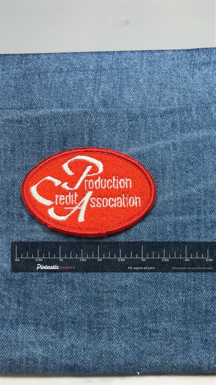 Production Credit Association Patch: Red Oval - Farm Finance Accessory with ruler overlay for size reference