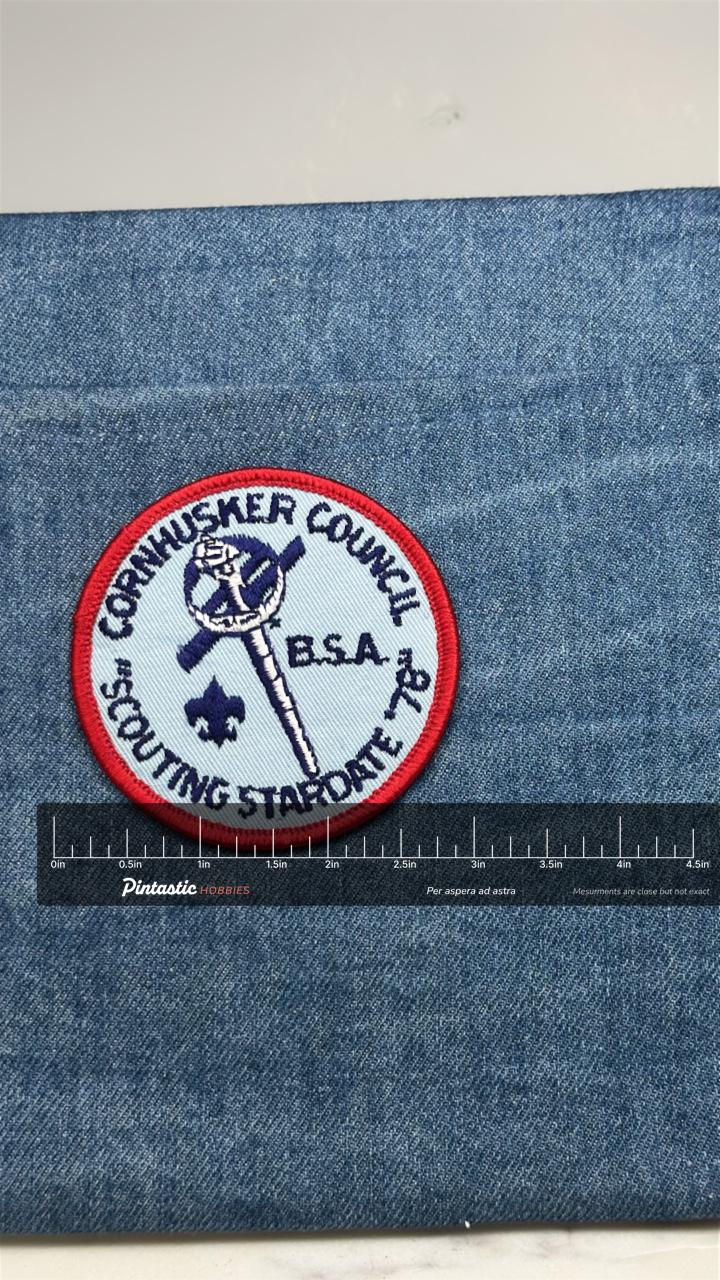 Cornhusker Council Patch: Red Border - BSA Scouting Staff with ruler overlay for size reference