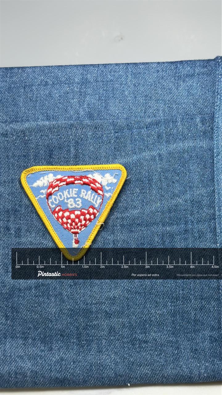 Cookie Rally 83 Patch: Triangle Yellow Border - 1983 Scout Accessory with ruler overlay for size reference