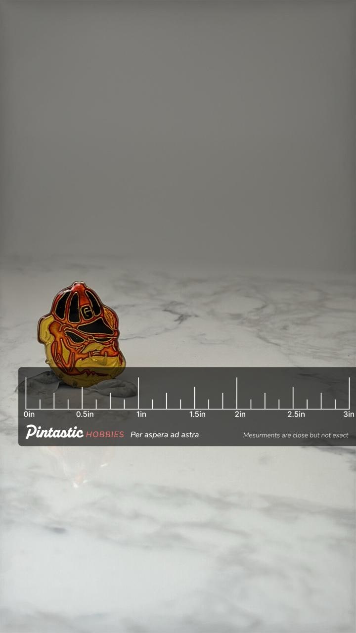 Vintage Georgia Bulldogs Enamel Lapel Pin Red Black Gold Football Mascot with ruler overlay for size reference