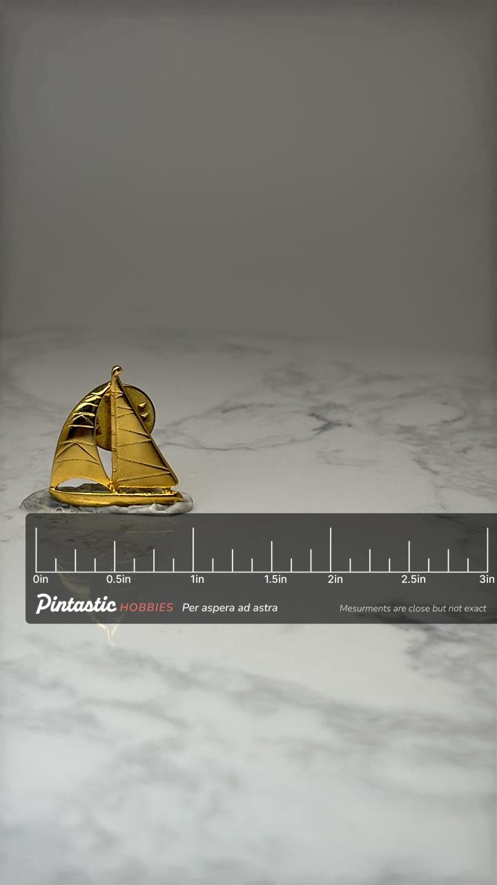 Sailboat Lapel Pin: Gold Tone Nautical - Vintage Maritime Accessory with ruler overlay for size reference