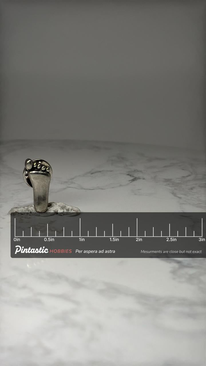 Baby Footprint Lapel Pin: Silver Tone Metal - Novelty Accessory with ruler overlay for size reference