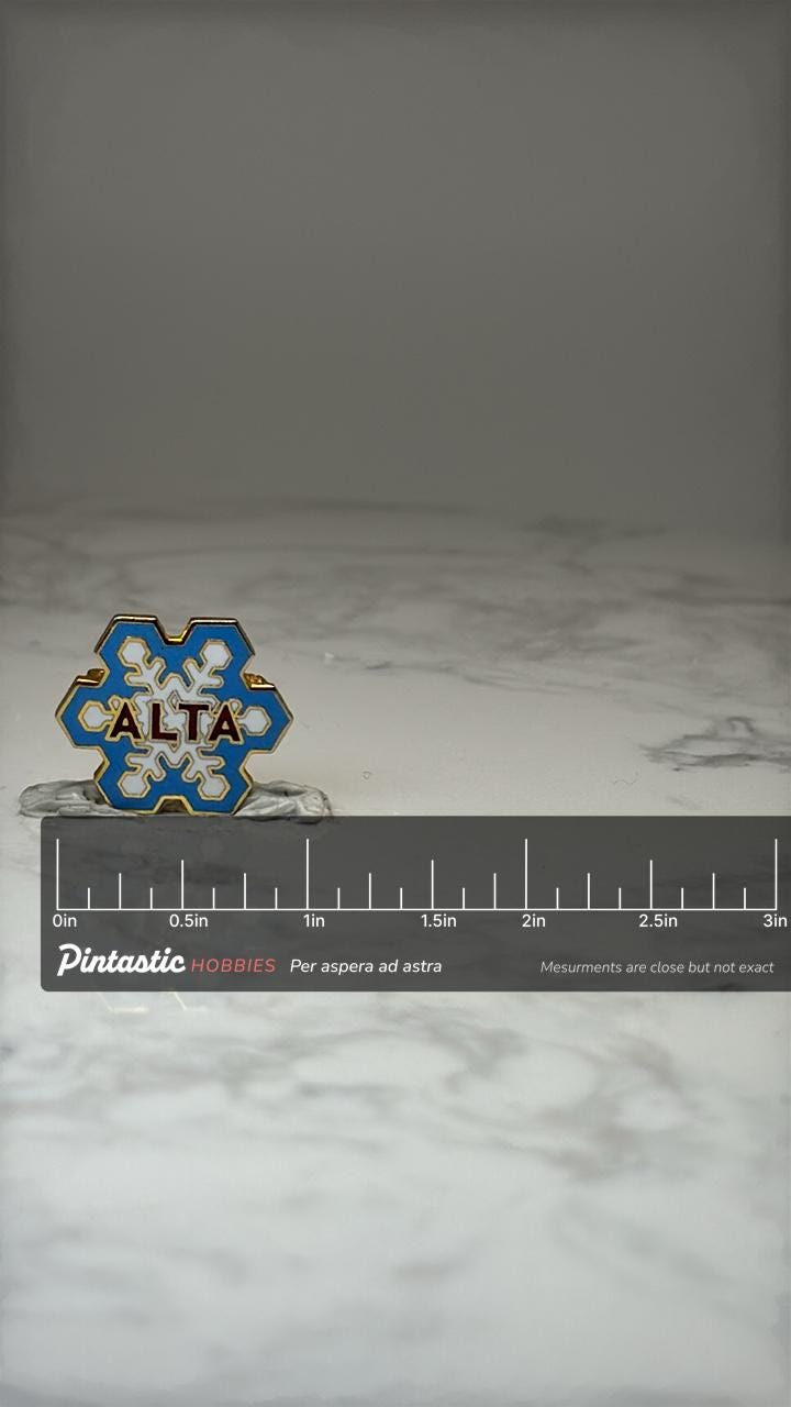 Vintage Alta Ski Resort Snowflake Lapel Pin Utah Skiing Souvenir Enamel Pin with ruler overlay for size reference